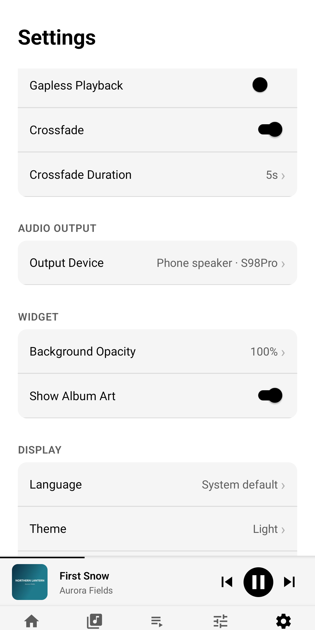 TuneWell settings showing gapless playback, crossfade and its duration, output device, widget options, language and theme (light theme)